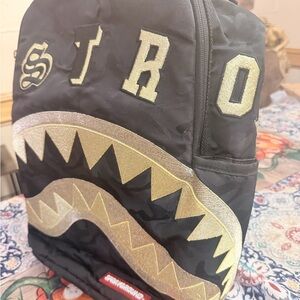Sprayground Black and Gold Shark Backpack